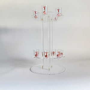 Clear acrylic display stand with multiple shelves on a white background