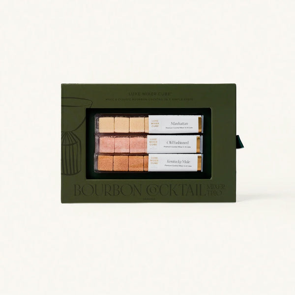 Set of bourbon cocktail mixers in a green box on a white background