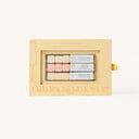 Champagne Mimosa makeup trio packaging on a light beige background