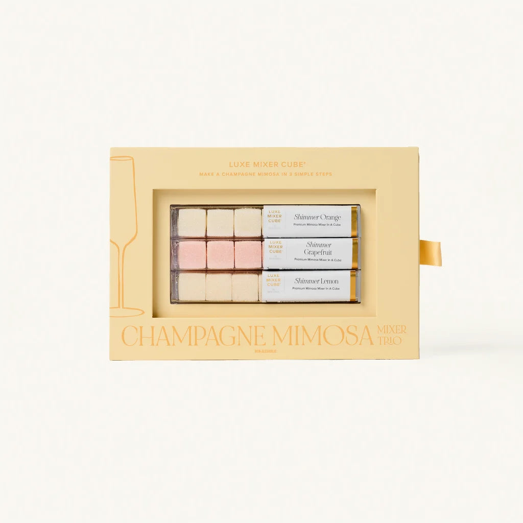 Champagne Mimosa makeup trio packaging on a light beige background