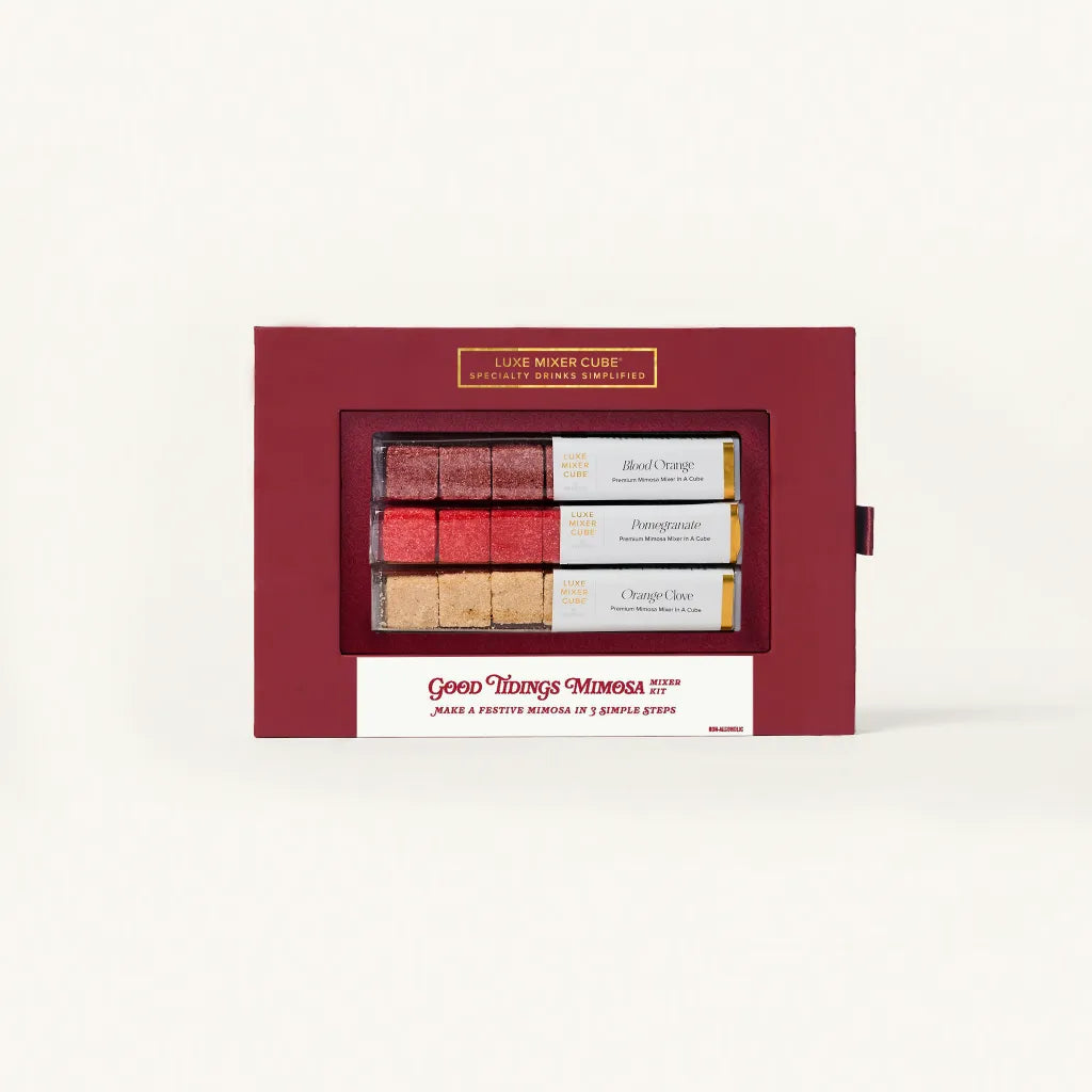Red gift box with a window displaying three small bottles of wine on a white background