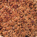 Close-up of a crumbly brown topping on a baked good