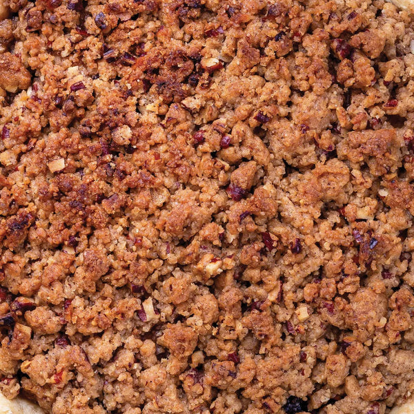 Close-up of a crumbly brown topping on a baked good