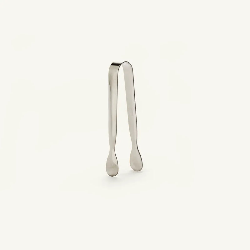 Metallic tongs on a white background